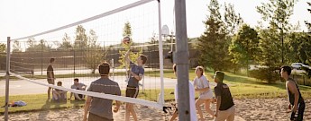 People playing beach volleyball